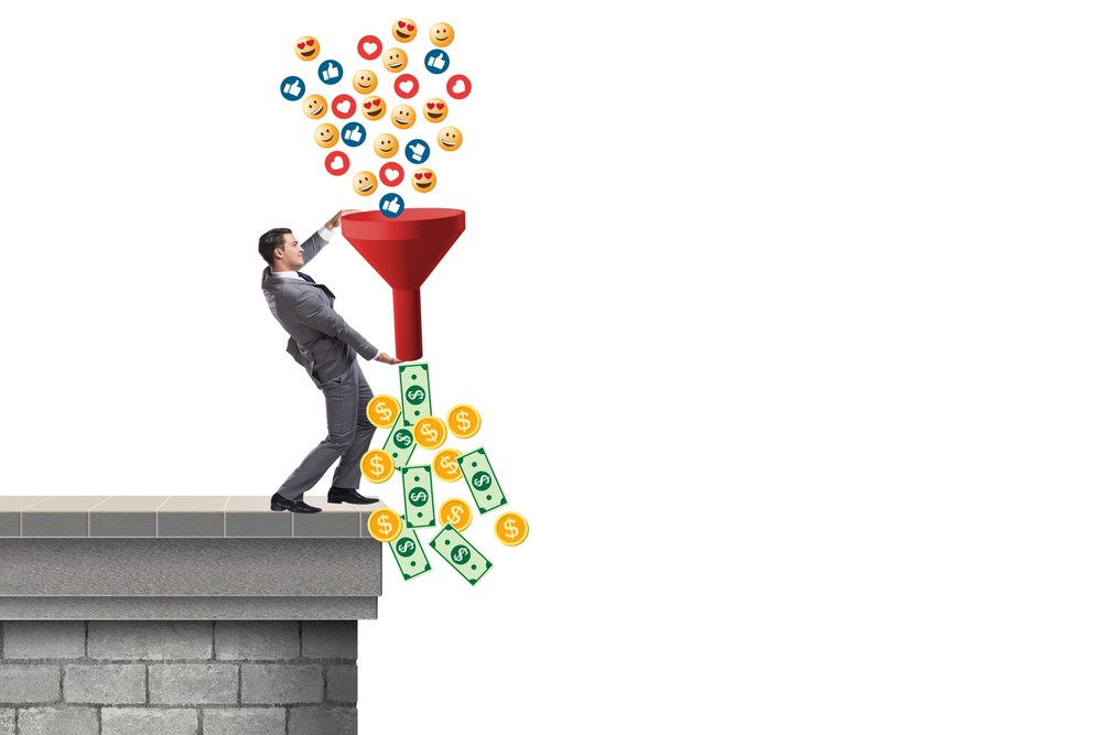 Mobile app monetization strategy concept with coins and a phone