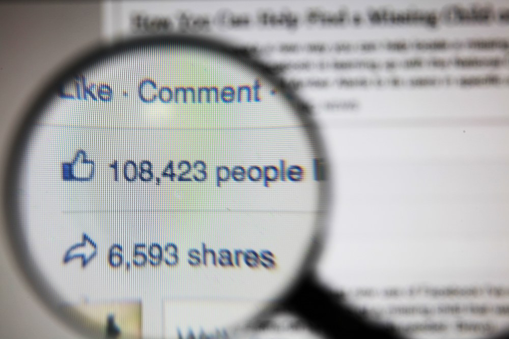 Person sharing content on a smartphone via social media