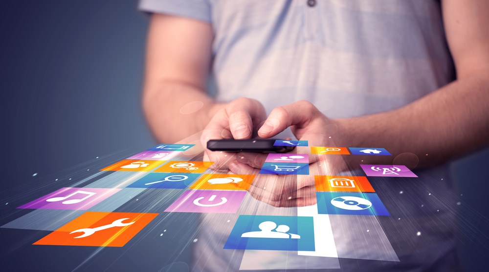 Person listening to music on a smartphone media app