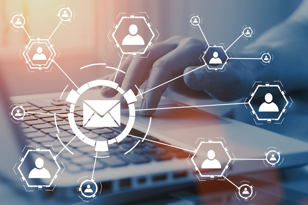 Marketer composing a personalized email campaign for app promotion