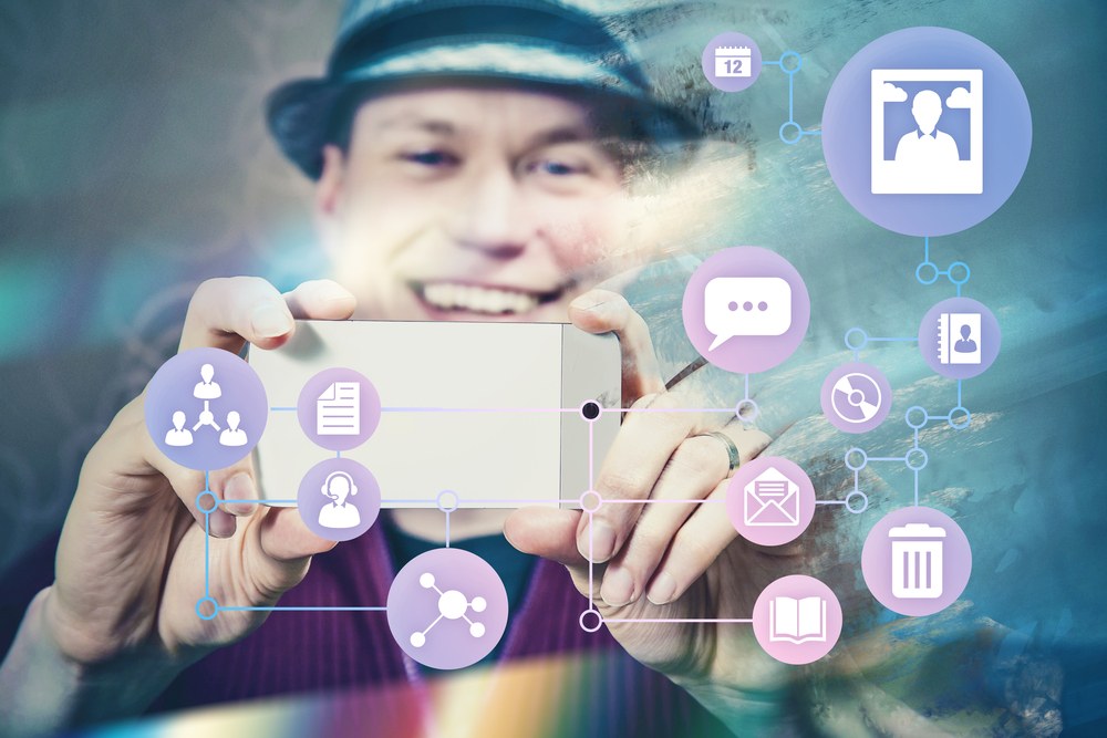 Person sharing content on a smartphone with social media apps