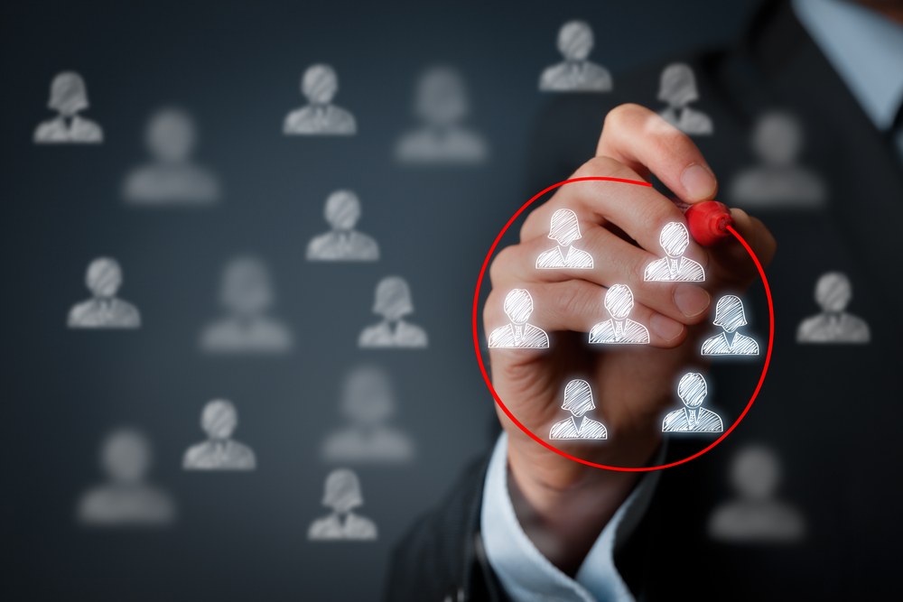 Marketers reviewing target audience demographics and analytics data