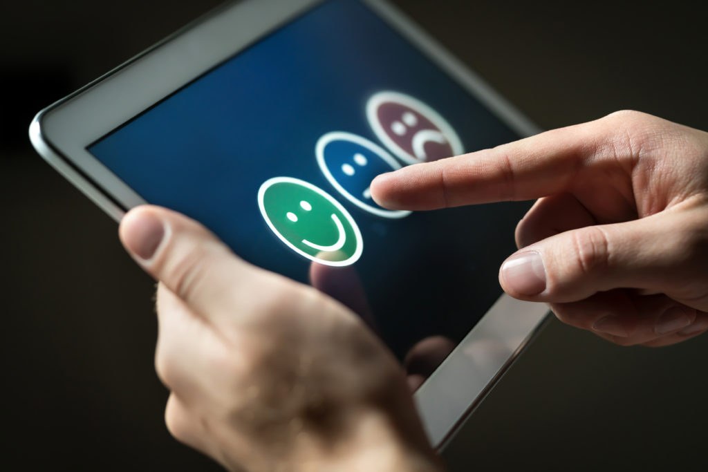 Customer leaving a five-star review on a mobile app
