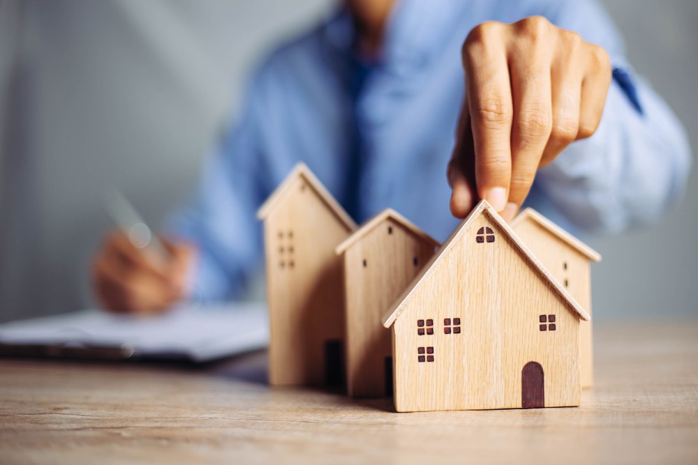 Person browsing real estate listings on a smartphone