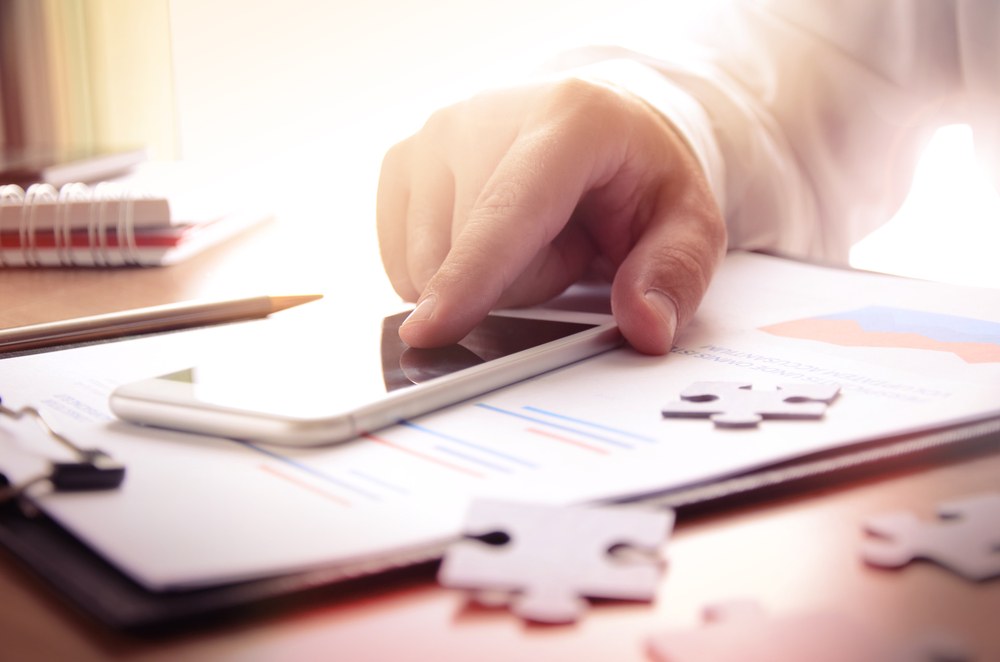 Casual gamer enjoying a puzzle game on a smartphone