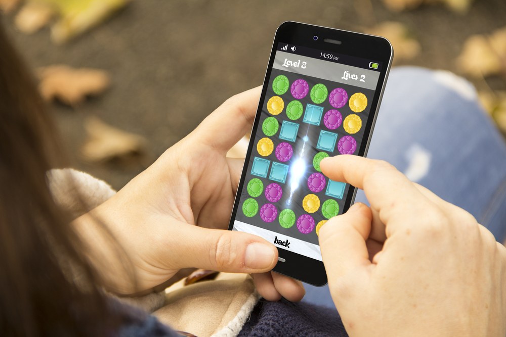 Social media influencer recording content for a mobile app review