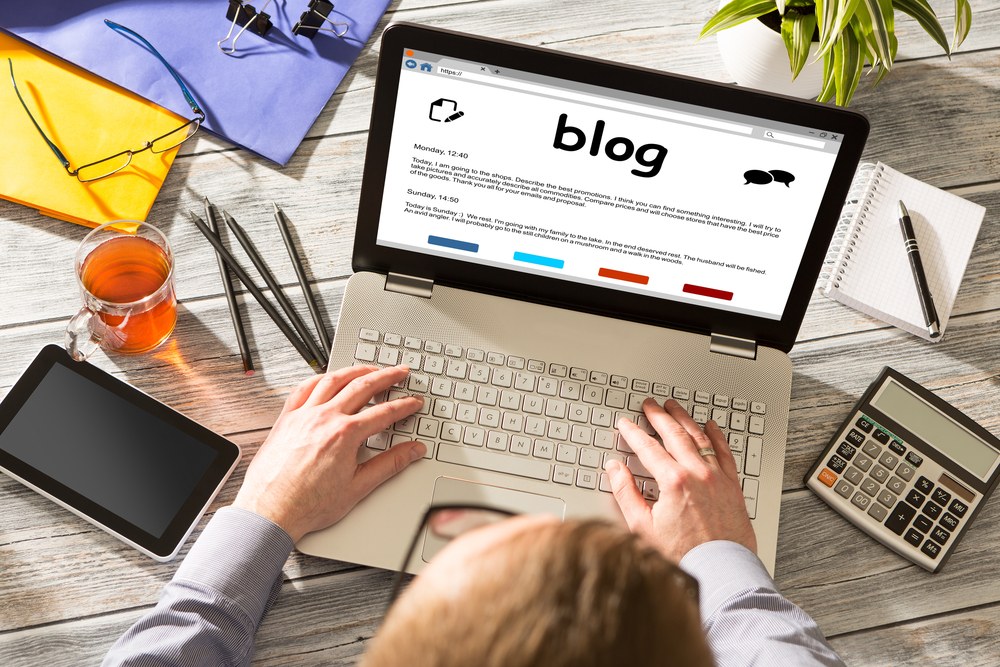 Content marketer writing a blog post at a desk