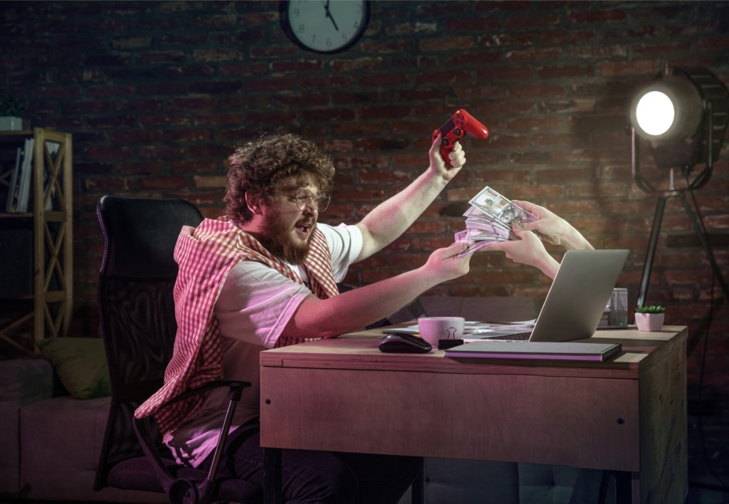 Person planning a mobile app business model at a desk