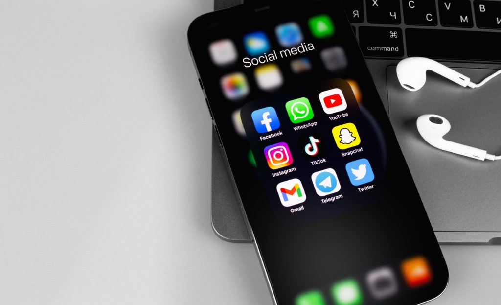 Person scrolling through social media videos on a smartphone
