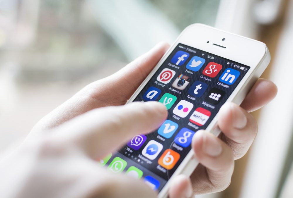 Person customizing a smartphone with personalization app options
