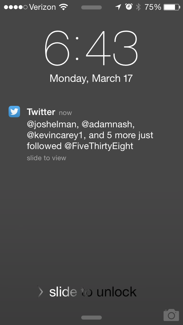 Twitter push notification with expandable image and account suggestion