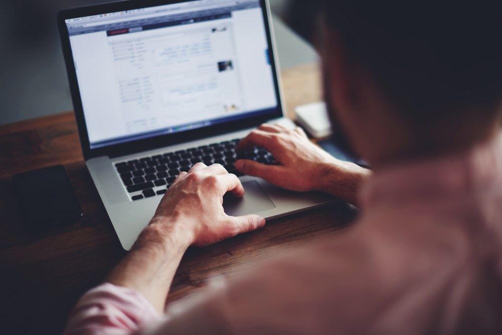 Marketer reviewing creative assets for an Apple Search Ads campaign