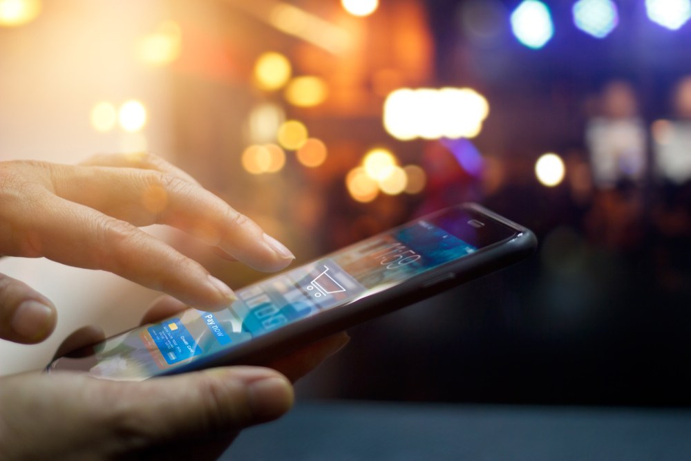 Person browsing a mobile app on a smartphone