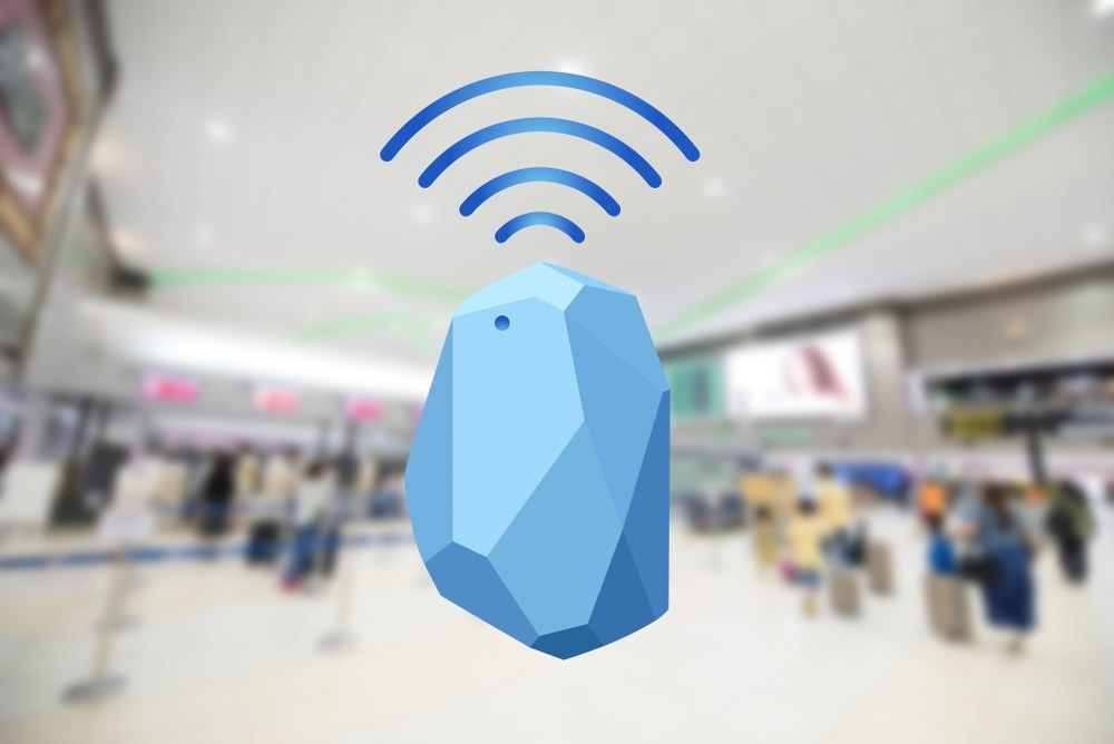 Bluetooth beacon transmitter sending signals to nearby smartphones in a store
