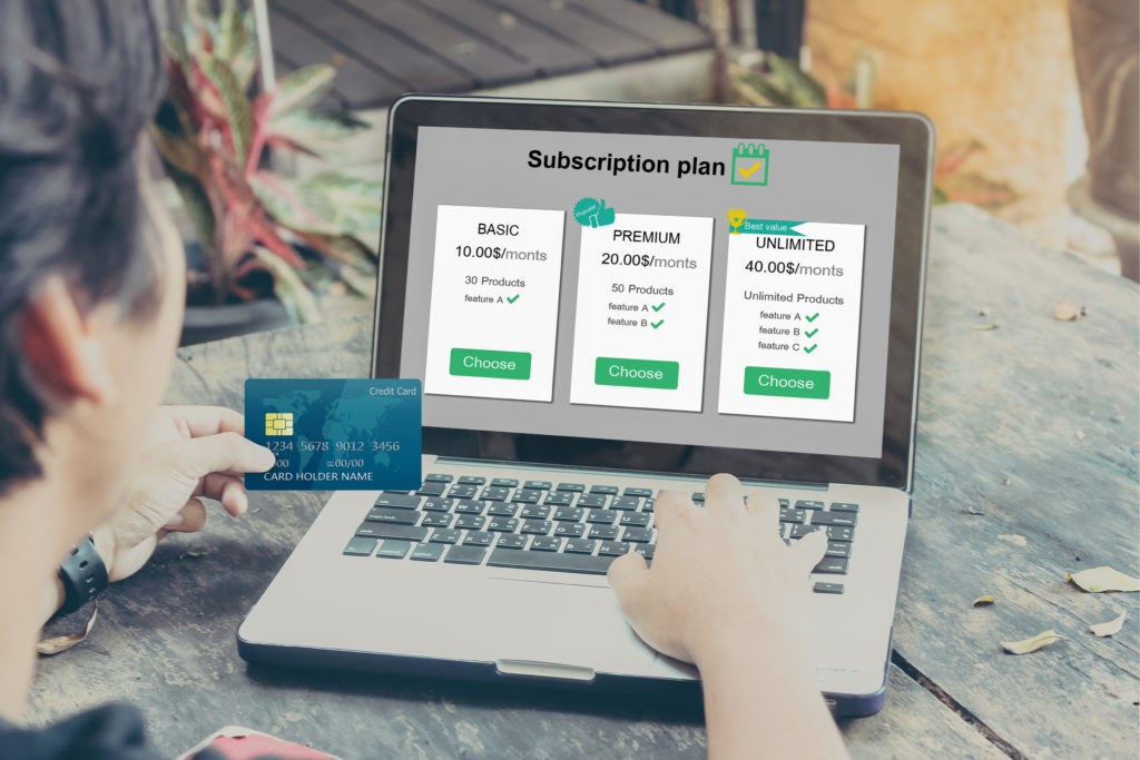 Person subscribing to a mobile app on a smartphone with a premium plan