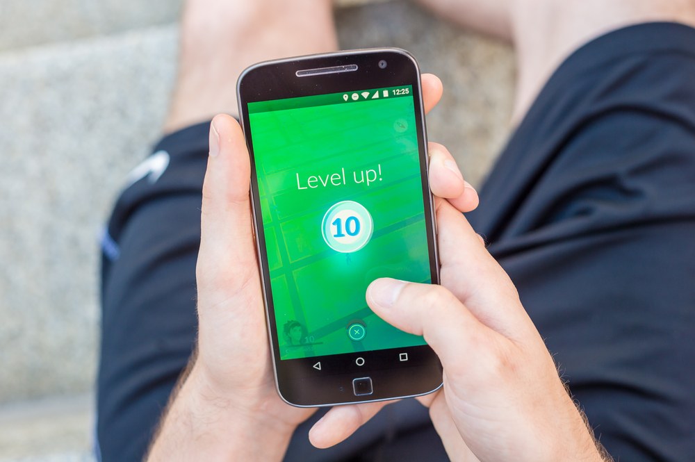 Mobile app UI showing a progress bar and level-up screen