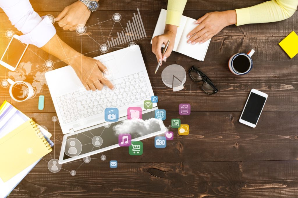 two-people-working-together-on-laptop-at-office-marketing-strategies-concept